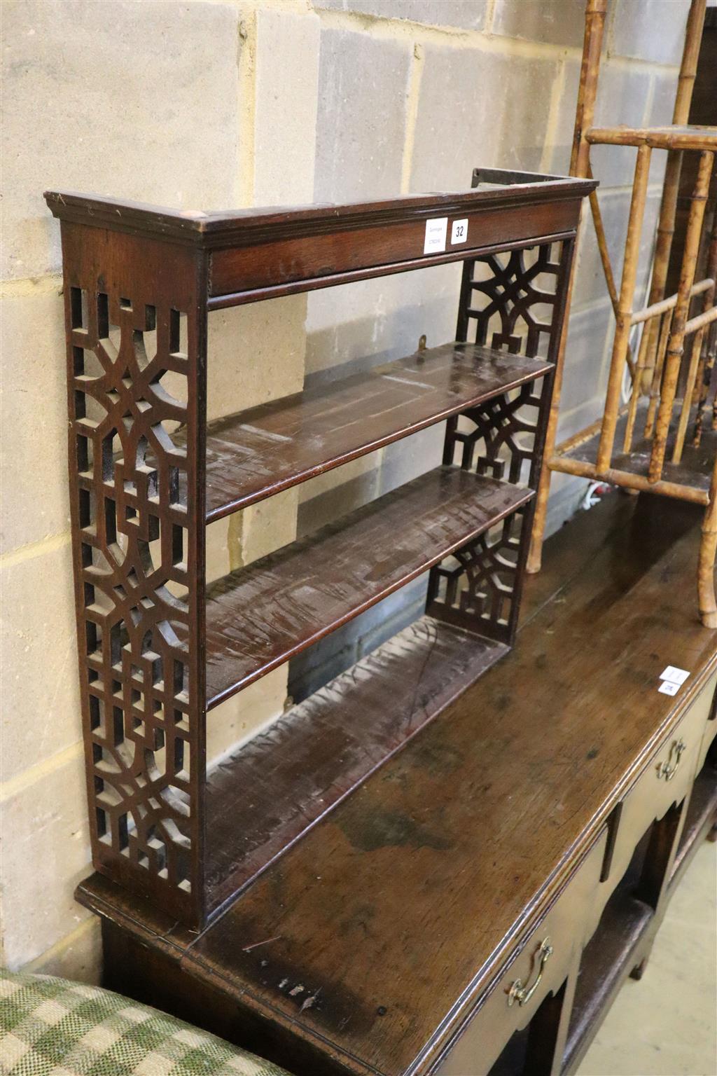 A George III style mahogany three shelf wall bracket, width 74cm, depth 16cm, height 67cm